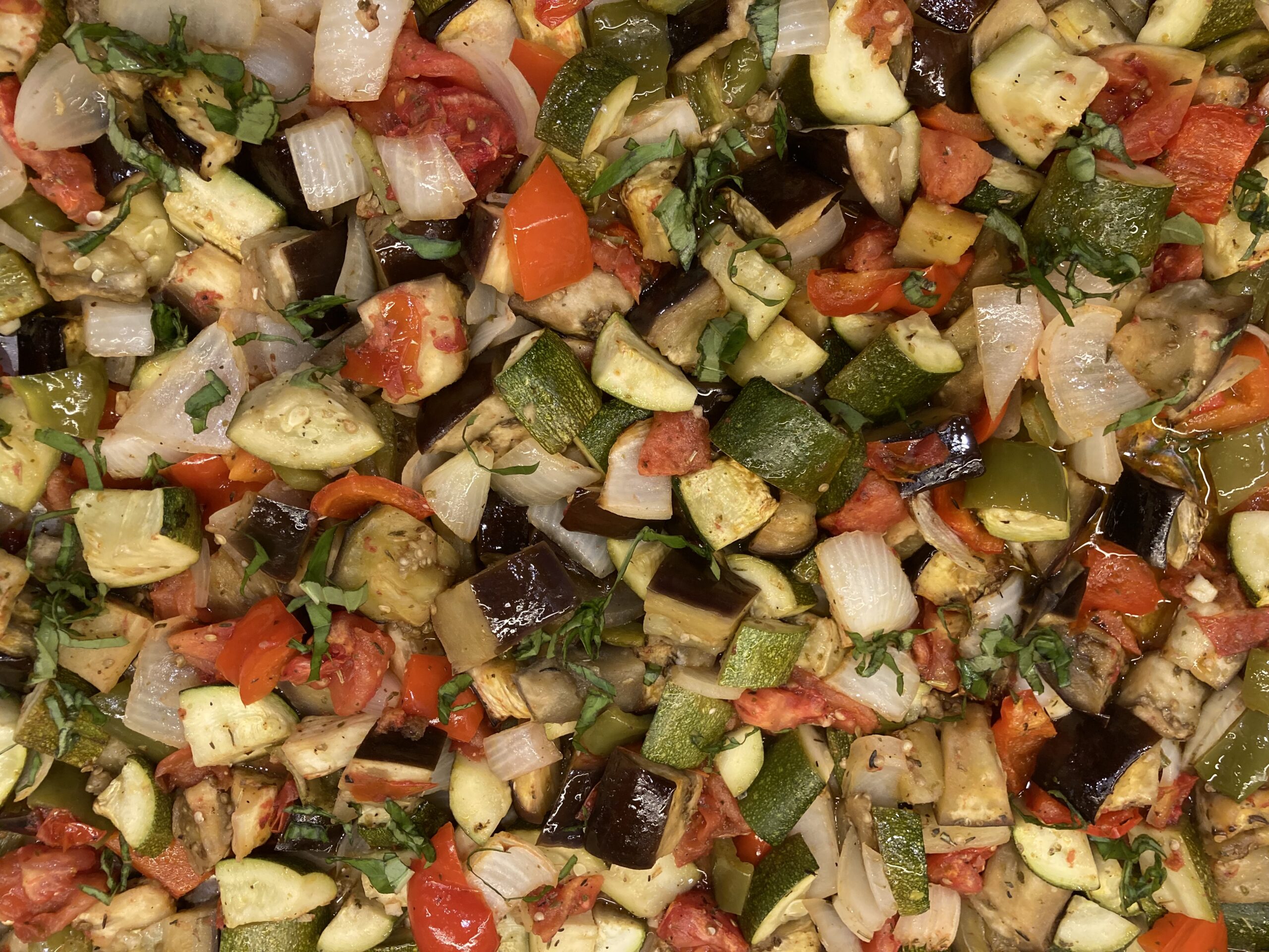 Ratatouille on a tray is a colorful classic French summer favorite made with seasonal produce including tomatoes, zucchini, bell peppers, eggplant and basil.